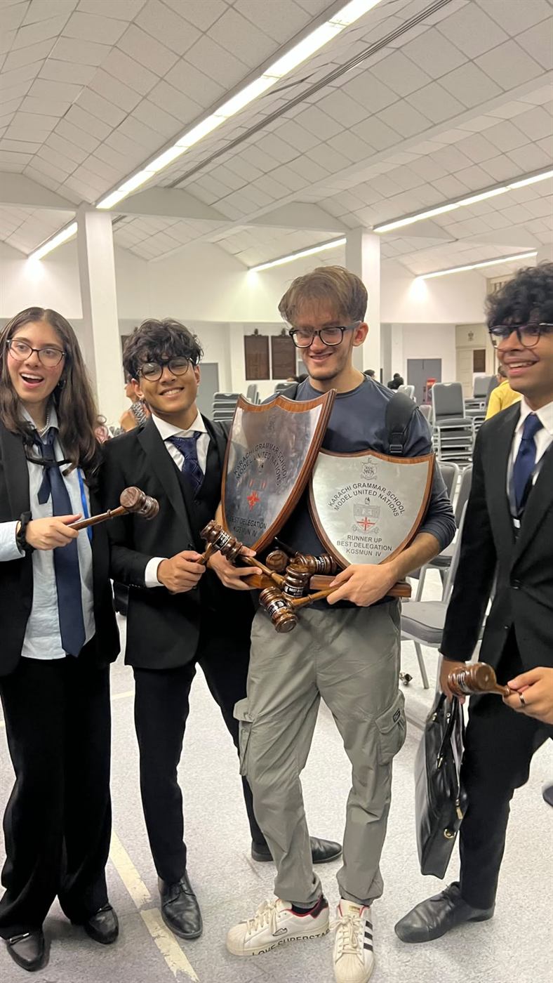Rohaan Arshad with the Best Delegation and Runner-up Delegation awards from Karachi Grammar School Model United Nations.